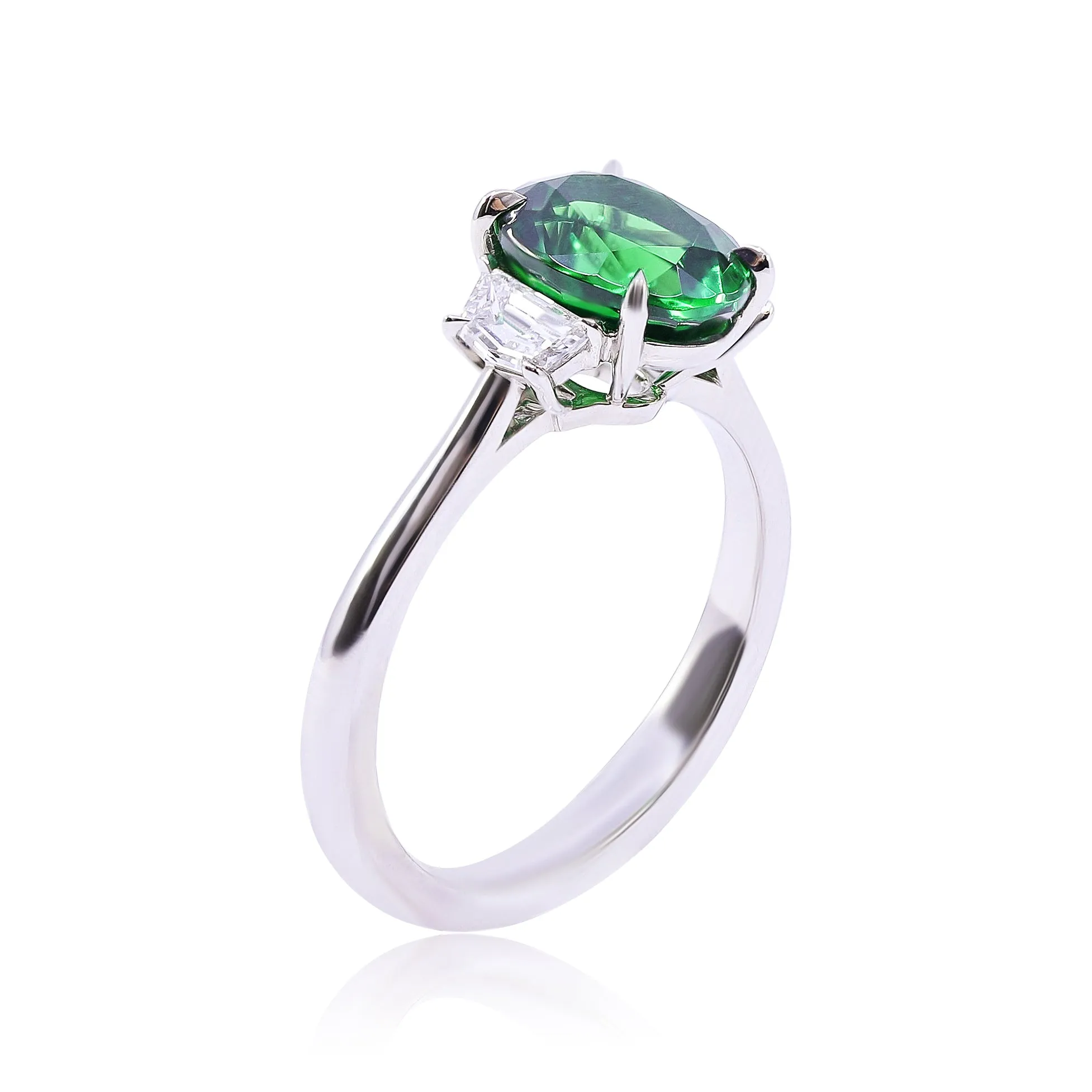 PLATINUM OVAL TSAVORITE GARNET AND DIAMOND THREE-STONE RING